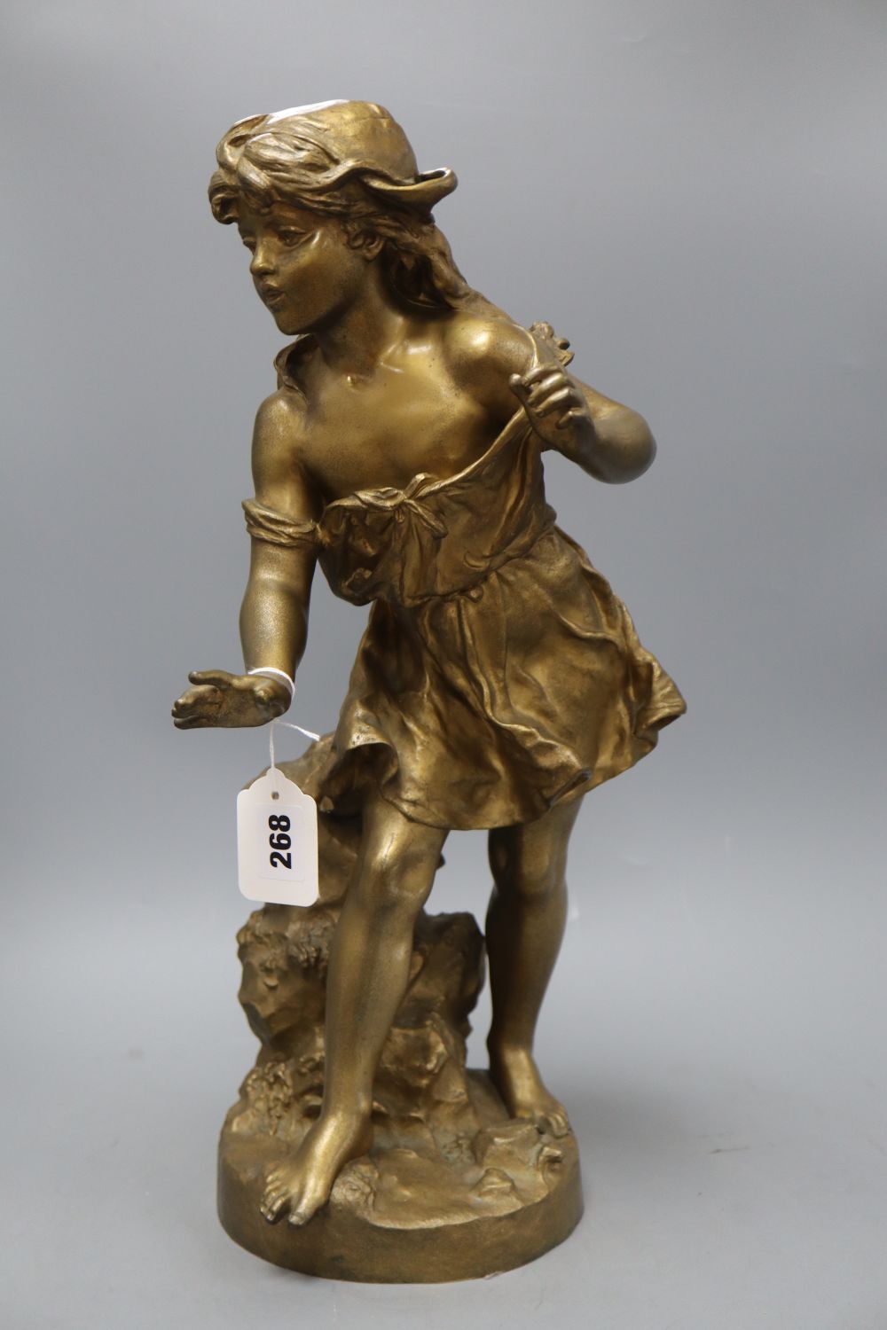 An early 20th century gold painted bronze model of a girl, height 50cm